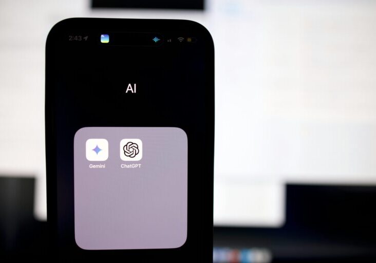 a close up of a cell phone with an ai button